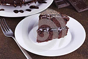 Luxurious Rich Chocolate Cake on White Plate