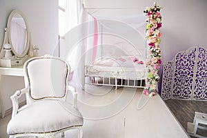 Luxurious room, bedroom with a bed chair and a ladies` table