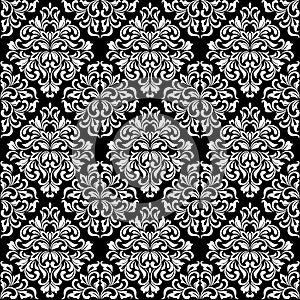 Luxurious seamless pattern. White ornate Damask ornament on a black background. Elegant tracery from swirls and foliage.