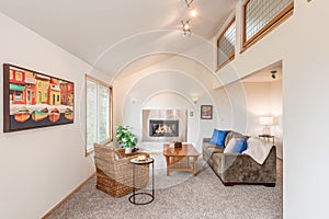 Luxurious and small living room family room with built-in fireplace and large window overlooking Forest