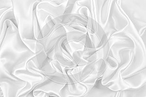 Luxurious of smooth white silk or satin fabric texture background