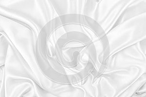 Luxurious of smooth white silk or satin fabric texture for background