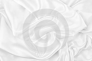 Luxurious of smooth white silk or satin fabric texture background