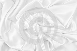 Luxurious of smooth white silk or satin fabric texture background