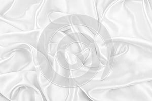 Luxurious of smooth white silk or satin fabric texture background