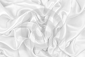 Luxurious of smooth white silk or satin fabric texture background