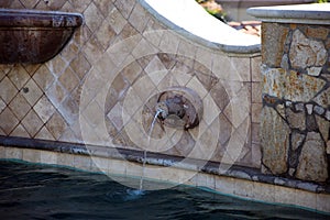 Luxurious spanish style pool with luxury water feature fountain at gorgeous villa with ocean view in Los Cabos Mexico