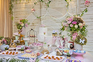 Luxurious table of sweets and birthday cake