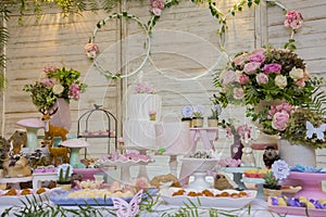 Luxurious table of sweets and birthday cake