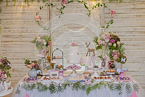 Luxurious table of sweets and birthday cake