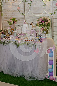 Luxurious table of sweets and birthday cake