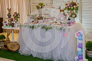 Luxurious table of sweets and birthday cake