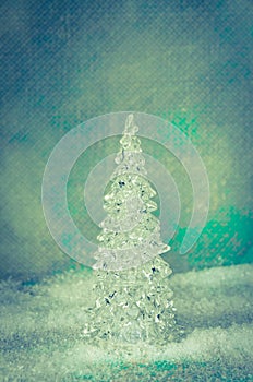 Luxurious vitreous christmas tree in snowy landscape photo
