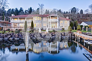 Luxurious waterfront home exterior. View from the deck.