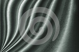 Luxurious wavy green fabric texture surface, curtain wave with a pattern background, macro texture of green striped fabric