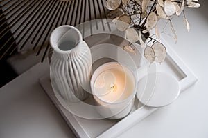 Luxurious white tray decoration, home interior decor with burning candle