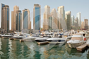 Luxurious Yachts and Boats in Front of Dubai Marina Skyscrapers