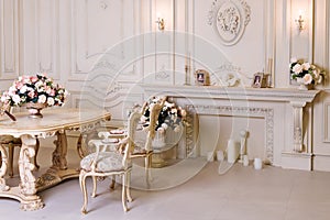 Luxury apartment, comfortable classic living room. Luxurious vintage interior with fireplace in the aristocratic style.