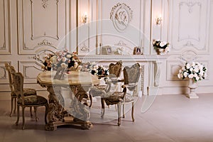 Luxury apartment, comfortable classic living room. Luxurious vintage interior with fireplace in the aristocratic style.