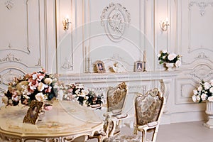 Luxury apartment, comfortable classic living room. Luxurious vintage interior with fireplace in the aristocratic style.