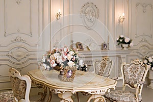 Luxury apartment, comfortable classic living room. Luxurious vintage interior with fireplace in the aristocratic style.