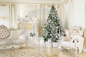 Luxury apartment decorated for christmas. Xmas tree with presents underneath in living room