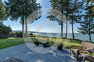 Luxury backyard exterior patio overlooks ocean view real estate