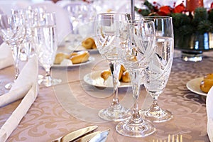 Luxury banquet table setting with crystal glasses