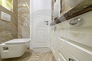 Luxury bathroom with beige marble tiles