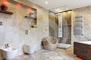 Luxury bathroom with beige tiles