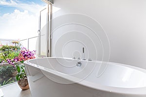 Luxury bathroom features bathtub with flower