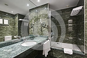 Luxury bathroom in green marble. Decoration hotel home interior