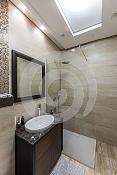 Luxury bathroom interior with glass shower cabin