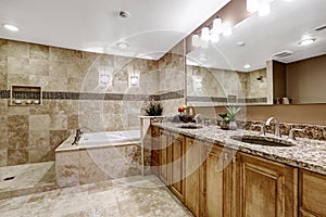 Luxury bathroom interior with tile floor.