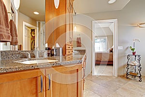 Luxury bathroom with large storage combination and granite tops