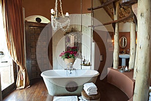 Luxury bathroom with red roses, Ngorongoro Crater Lodge, Tanzania