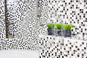 Luxury bathtub detail with stone finish and flowers