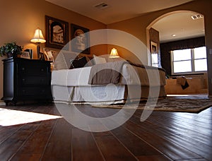 Luxury Bedroom with Hardwood Flooring photo