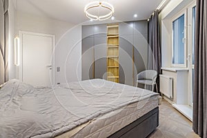 Luxury bedroom interior with double bed and gray window curtains