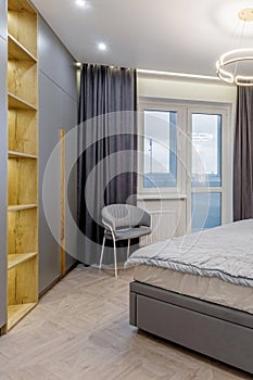 Luxury bedroom interior with double bed and gray window curtains