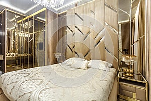 Luxury bedroom interior with parquet and mirror walls