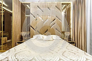 Luxury bedroom interior with parquet and mirror walls