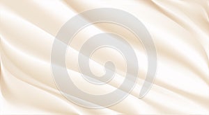 The luxury of beige or cream fabric texture background.Closeup of rippled gold silk fabric.