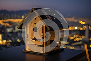 luxury birdhouse with heated floor and bathroom, and view of the city skyline