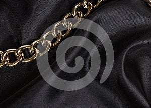 Luxury black wavy silk texture with frame of chain background