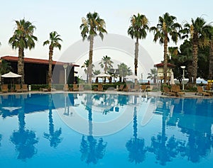 Luxury blue swimming pool at tropical resort