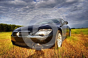 Luxury bmw cabriolet in rural scene, hdr