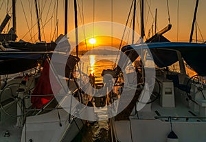 Luxury boats at Poros island in Greece against the sunset. Sailing in Greece.