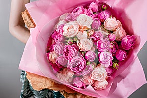 Luxury bouquets of flowers Pink Colour peonies and roses in the hands women.