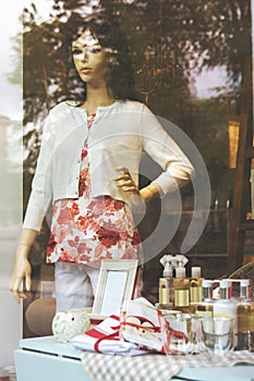 Luxury Boutique fashion display window with a colorful dressed m